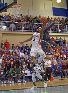 Khary Mauras (3) of Reading goes to the basket against Taylor Allderdice during their PIAA Class AAAA boys basketball semifinal Tuesday night at Chambersburg High School. (Ashley J. Palmer - For PA Prep Live)