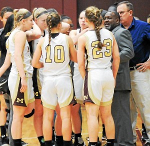 Governor Mifflin head coach Micharl Clark, right, addresses his team during a non-conference game against Pottsville on Saturday afternoon. The Mustangs improved to 20-1 overall with a 65-51 win over the Crimson Tide. (John Strickler - Digital First Media)