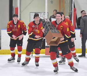 Haverford captain Jacob Orazi carries the Flyers Cup Class AA as they defeated Downingtown West Tuesday evening. (Pete Bannan/MediaNews Group)